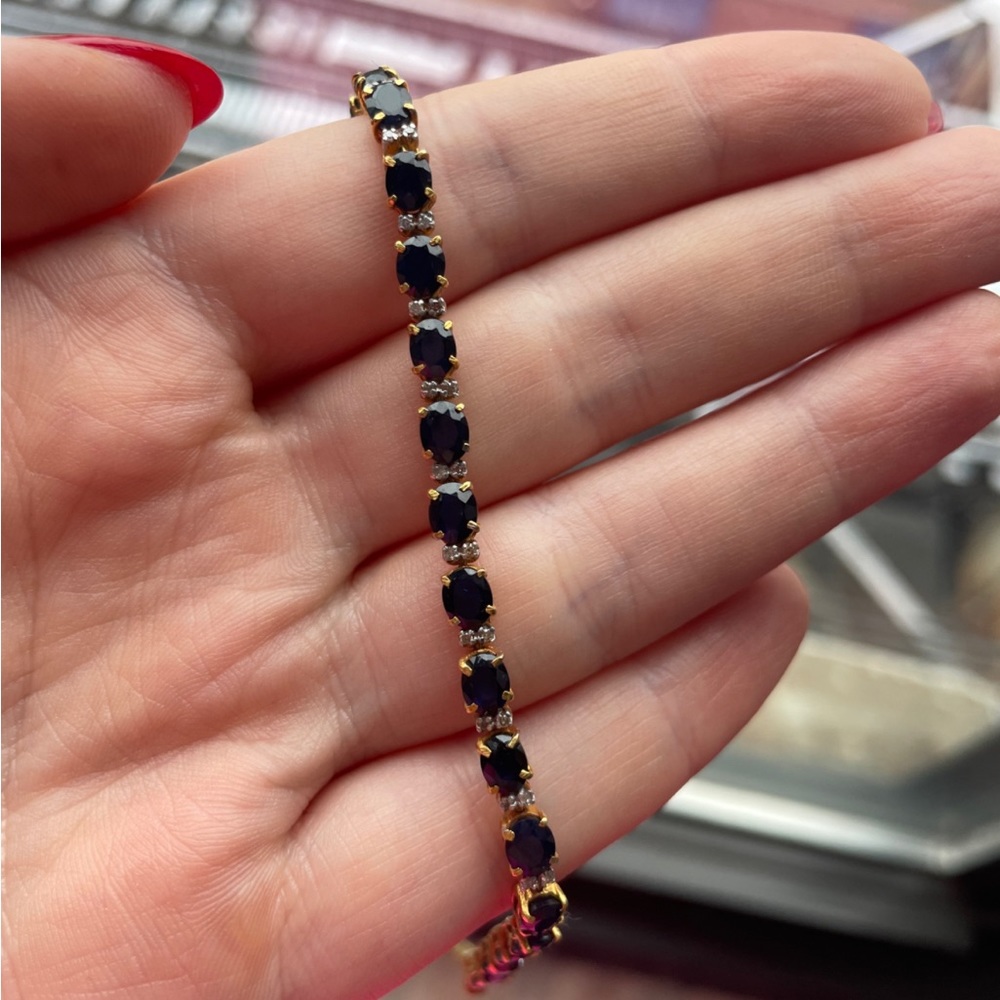 18KT yellow gold lady's cast and hand assembled tennis style bracelet.